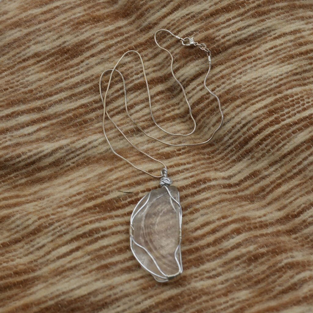a silver-wrapped white beach glass necklace