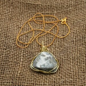 Black and white marbled stone necklace wrapped in gold wire with gold chain