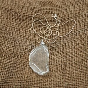 White beach glass necklace wrapped in silver wire with silver chain