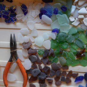 collection of beach glass in the process of being wire-wrapped