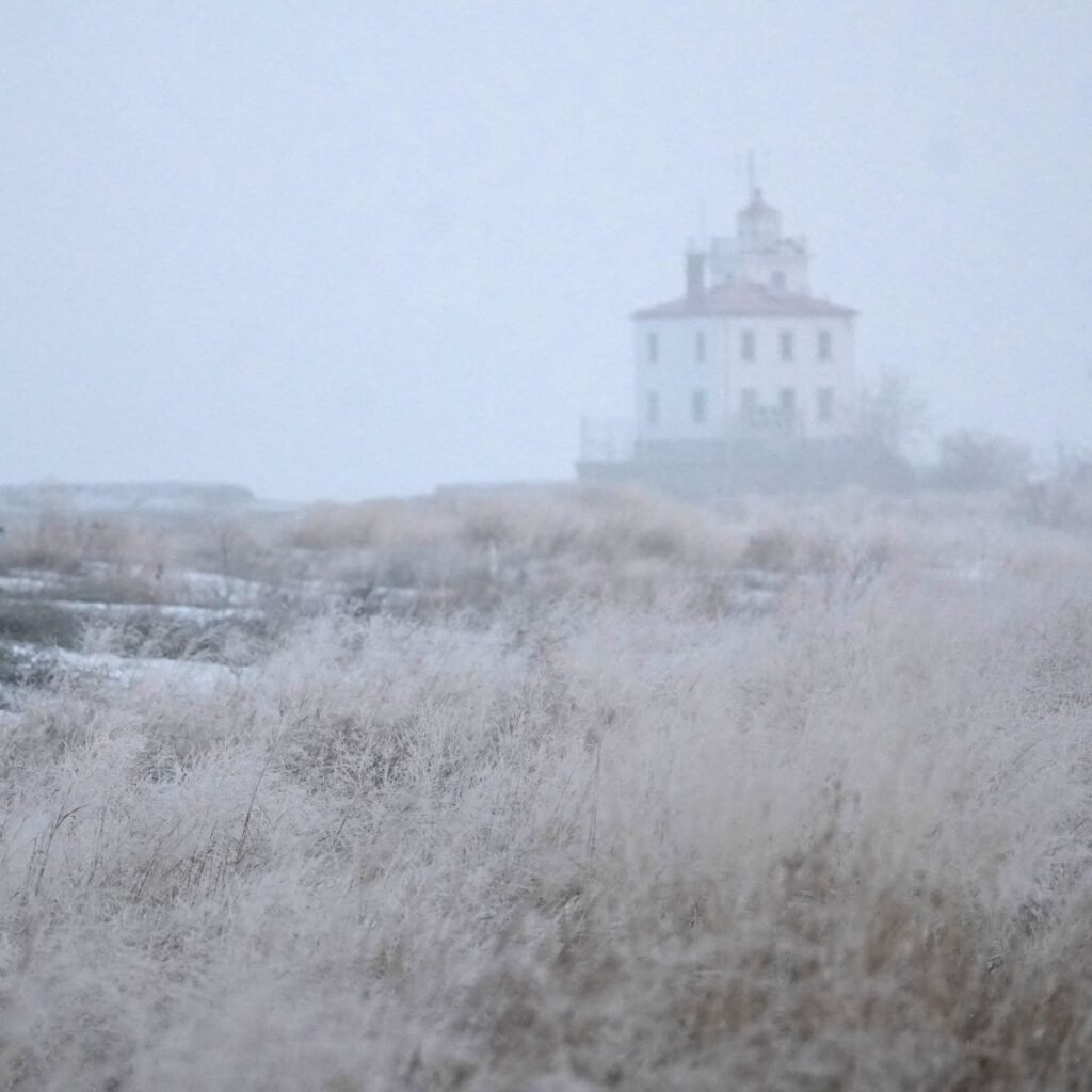 Fairport Harbor lighthouse and Headlands Dunes beach in the snow